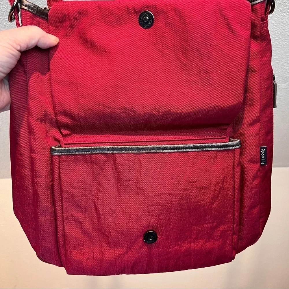 CORTILE FABRIC BACKPACK. Adj Straps. Front Flap Pocket w/snap & zipper pocket